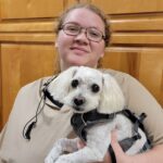 Picture of Ashley holding white dog